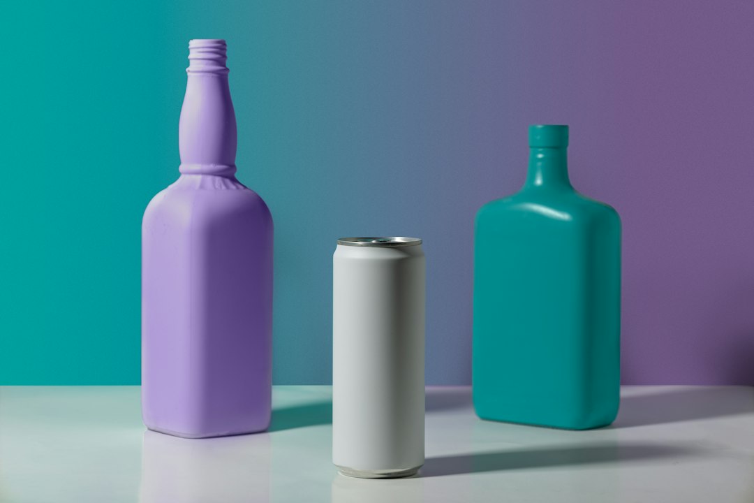 Assorted colorful beverage cans and bottles arranged as an editorial still life