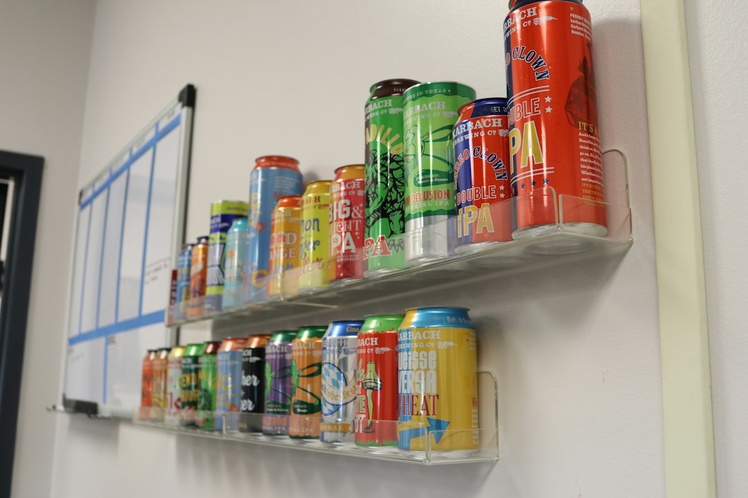 Colorful independent beverage cans displayed on a retail shelf